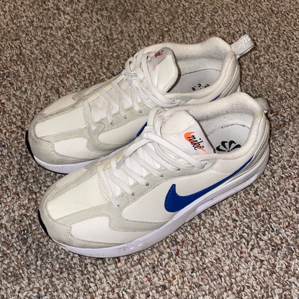 White gray and blue Nike shoes